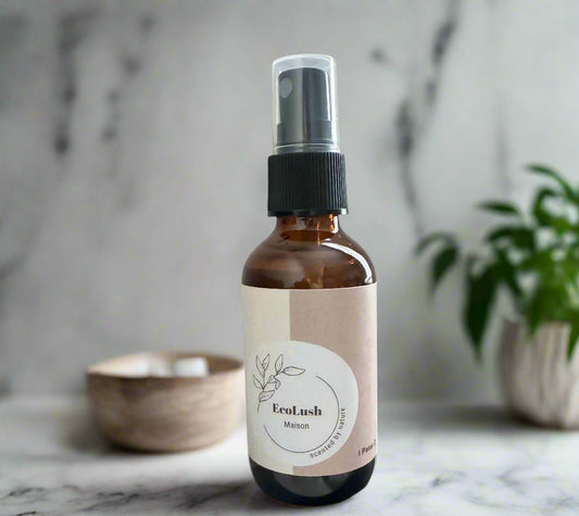 Eco-friendly air freshener in glass spray bottle made with non-toxic clove essential oils to remove odors.