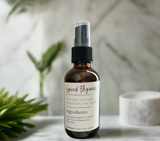 Eco-friendly air freshener in glass spray bottle made with non-toxic clove essential oils to remove odors.