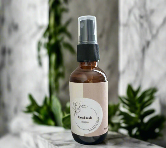 Eco-friendly air freshener in glass spray bottle made with non-toxic lemongrass essential oils to remove odors.