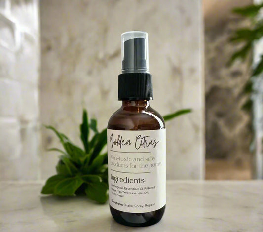 Eco-friendly air freshener in glass spray bottle made with non-toxic lemongrass essential oils to remove odors.