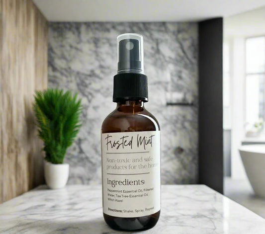 Eco-friendly air freshener in glass spray bottle made with non-toxic peppermint essential oils to remove odors.